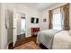 Bedroom with a view to the bathroom featuring wood floors, a patterned rug, and an outside view at 2745 Bonnybrook Cir, Rock Hill, SC 29732