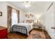 Inviting bedroom with rustic decor, patterned curtains, and a cozy rug on hardwood floors at 2745 Bonnybrook Cir, Rock Hill, SC 29732