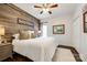 Charming bedroom showcasing wood wall accent, plush rug, and a comfortable bed at 2745 Bonnybrook Cir, Rock Hill, SC 29732