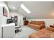 Versatile bonus room featuring a skylight, comfortable seating, and space for a home office at 2745 Bonnybrook Cir, Rock Hill, SC 29732
