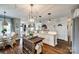 Open concept kitchen with island, stainless steel appliances, granite counters, and wood flooring throughout at 2745 Bonnybrook Cir, Rock Hill, SC 29732