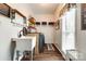 Functional laundry room equipped with a sink, washer, dryer, and ample storage solutions at 2745 Bonnybrook Cir, Rock Hill, SC 29732