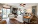 Spacious living room featuring a fireplace, large windows, ceiling fan and comfortable seating area at 2745 Bonnybrook Cir, Rock Hill, SC 29732