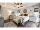 Bright main bedroom with ceiling fan, wood floors, decorative touches, and plenty of natural light at 2745 Bonnybrook Cir, Rock Hill, SC 29732