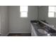 Bathroom featuring double sink vanity with granite counters and large mirror at 2792 5Th Ne Ave, Hickory, NC 28601