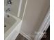 Clean and modern bathtub with white surround and updated faucet at 2792 5Th Ne Ave, Hickory, NC 28601