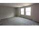 Spacious bedroom with plush carpeting and an abundance of natural light from the windows at 2792 5Th Ne Ave, Hickory, NC 28601
