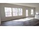 Bright living room featuring luxury vinyl plank flooring and multiple windows at 2792 5Th Ne Ave, Hickory, NC 28601