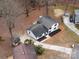 Aerial view of modern home with a well-manicured lot, and newly sealed driveway at 301 Dollar Cir, Charlotte, NC 28270
