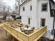 Spacious backyard featuring a newly constructed deck, with outdoor seating and dining at 301 Dollar Cir, Charlotte, NC 28270