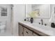Modern bathroom with dual sink vanity, decorative mirror, and spacious walk-in shower at 301 Dollar Cir, Charlotte, NC 28270