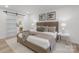 Comfortable bedroom features a sliding barn door to the bathroom and modern decor at 301 Dollar Cir, Charlotte, NC 28270