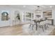 The dining area boasts modern decor, a large window, and stylish lighting, ideal for entertaining at 301 Dollar Cir, Charlotte, NC 28270