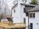 Beautiful two-story home featuring a new deck with railings and outdoor dining furniture at 301 Dollar Cir, Charlotte, NC 28270