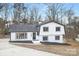 Front exterior view of a charming two-story home with a well-manicured lawn and ample parking at 301 Dollar Cir, Charlotte, NC 28270