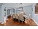 A spacious dining room with a large table, hardwood floors and natural light at 3173 Delaware Dr, Denver, NC 28037