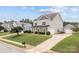 Well-maintained home with a detached two-car garage, lush lawn, and a charming curb appeal at 3173 Delaware Dr, Denver, NC 28037