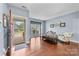 Welcoming foyer with hardwood floors, natural light, and a glimpse of the exterior landscape at 3173 Delaware Dr, Denver, NC 28037