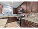 Close-up of a modern kitchen with granite counters and stainless steel appliances at 3173 Delaware Dr, Denver, NC 28037