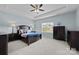 Serene main bedroom with a tray ceiling, a large window, and elegant furnishings at 3173 Delaware Dr, Denver, NC 28037