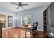 Bright office space with hardwood floors, French doors, and built-in shelving at 3173 Delaware Dr, Denver, NC 28037