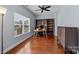Bright office space with hardwood floors, large window, and built-in shelving at 3173 Delaware Dr, Denver, NC 28037