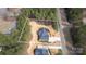 Aerial view of a house on a sprawling lot, surrounded by lush trees and a long driveway at 318 Lewis Ferry Rd, Statesville, NC 28677