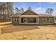 Expansive backyard featuring a covered patio, perfect for outdoor relaxation and entertaining at 318 Lewis Ferry Rd, Statesville, NC 28677