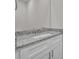 Bathroom featuring a granite countertop, modern hardware, and a large mirror, creating a clean and stylish space at 318 Lewis Ferry Rd, Statesville, NC 28677