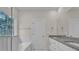 This is a bathroom with dual sinks, granite countertops, and a separate bathtub at 318 Lewis Ferry Rd, Statesville, NC 28677