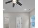 Bright bedroom featuring a ceiling fan, recessed lighting, and closet and bathroom doors at 318 Lewis Ferry Rd, Statesville, NC 28677