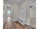 A welcoming entryway with wood-style flooring and a built-in bench and coat rack at 318 Lewis Ferry Rd, Statesville, NC 28677