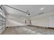 Spacious two car garage with overhead lighting and smooth concrete floors at 318 Lewis Ferry Rd, Statesville, NC 28677