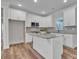 Bright kitchen features granite countertops, stainless appliances, and a center island, perfect for entertaining at 318 Lewis Ferry Rd, Statesville, NC 28677