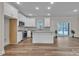 Open kitchen with island, stainless appliances, granite counters, and seamless flow to the living area at 318 Lewis Ferry Rd, Statesville, NC 28677