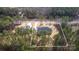 An aerial shot showcases the property's setting amidst lush greenery and surrounding trees, ensuring privacy at 326 Lewis Ferry Rd, Statesville, NC 28677