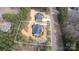 Aerial view of a home on a spacious lot, surrounded by lush greenery and mature trees at 326 Lewis Ferry Rd, Statesville, NC 28677