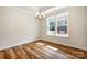Light-filled dining area with hardwood floors and stylish chandelier, perfect for Gathering meals at 326 Lewis Ferry Rd, Statesville, NC 28677