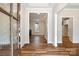 Inviting foyer with wood-look flooring, showcasing the entrance and the view into the living room at 326 Lewis Ferry Rd, Statesville, NC 28677