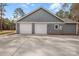 Exterior side view of a home featuring a spacious three car garage and grey siding at 326 Lewis Ferry Rd, Statesville, NC 28677