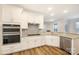 Modern kitchen with stainless steel appliances, granite countertops, and white cabinetry at 326 Lewis Ferry Rd, Statesville, NC 28677