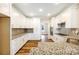 Bright kitchen with granite countertops, stainless steel appliances, and ample cabinet space at 326 Lewis Ferry Rd, Statesville, NC 28677