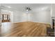 Spacious living room with wood floors, fireplace, and ample natural light; a great space for entertaining at 326 Lewis Ferry Rd, Statesville, NC 28677