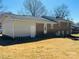 Side view of a brick home with a well-maintained yard at 344 Circleview Dr, Shelby, NC 28150