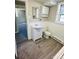 Bathroom featuring vanity, mirror, overhead storage, toilet, and wood-look flooring with a rug at 344 Circleview Dr, Shelby, NC 28150