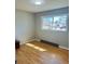 Bedroom features gray walls, wood floors, white trim, and a window letting in plenty of natural light at 344 Circleview Dr, Shelby, NC 28150