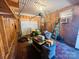 The cluttered garage features a white door and a yard tractor to keep your yard nicely maintained at 344 Circleview Dr, Shelby, NC 28150