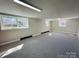 This living room features carpeted floors and natural lighting from two windows at 344 Circleview Dr, Shelby, NC 28150