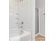 Cozy bathroom features a tub and shower with white subway tile surround at 3465 Caldwell Ridge Pkwy, Charlotte, NC 28213