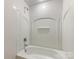Clean, well-lit bathroom featuring a white tub and shower combination with tile surround at 3465 Caldwell Ridge Pkwy, Charlotte, NC 28213